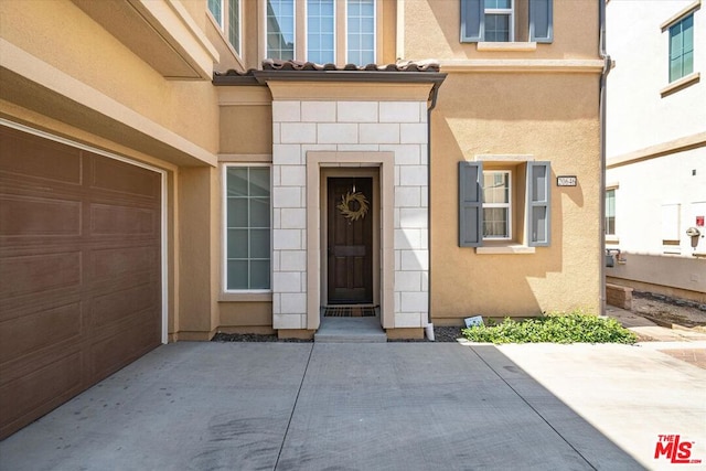 entrance to property featuring a garage