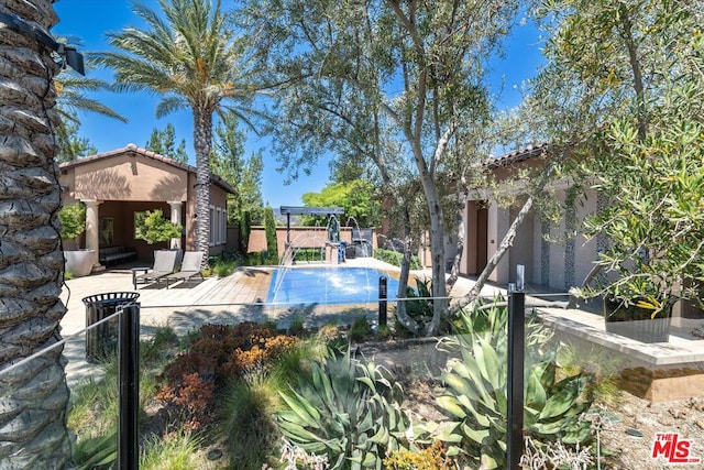 view of pool featuring a patio area