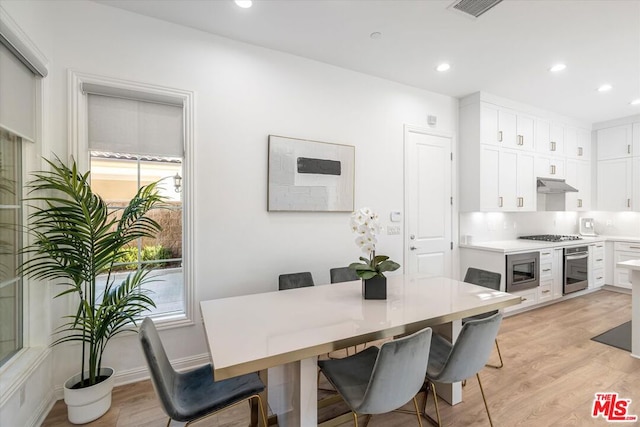 dining space featuring light hardwood / wood-style flooring