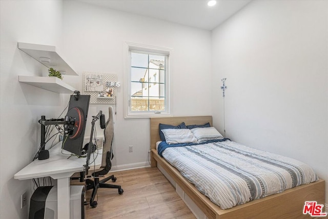 bedroom featuring light wood-type flooring