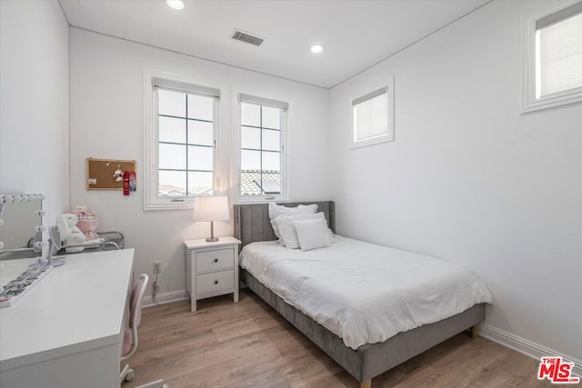 bedroom with wood-type flooring