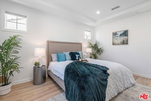 bedroom with light hardwood / wood-style floors