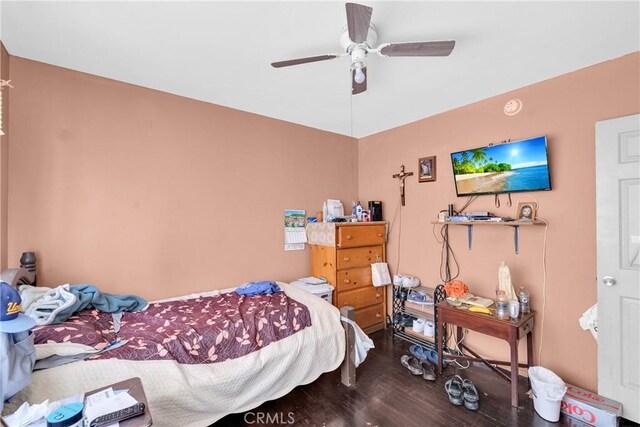 bedroom featuring hardwood / wood-style floors and ceiling fan