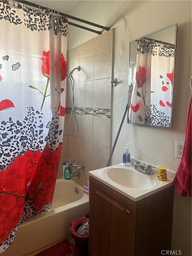 bathroom featuring vanity and shower / tub combo