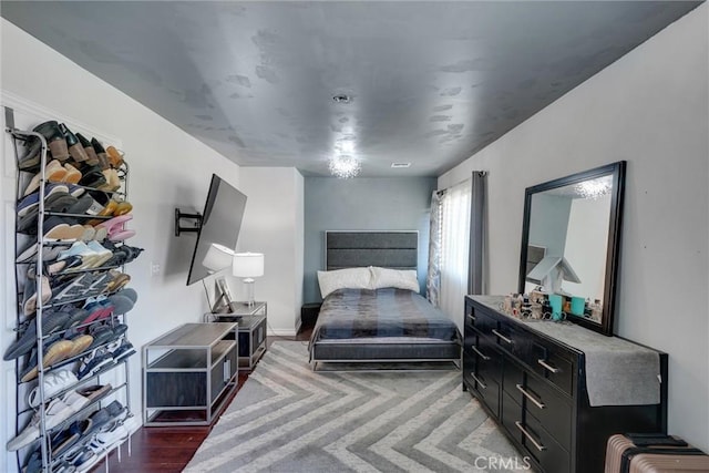 bedroom featuring dark hardwood / wood-style floors