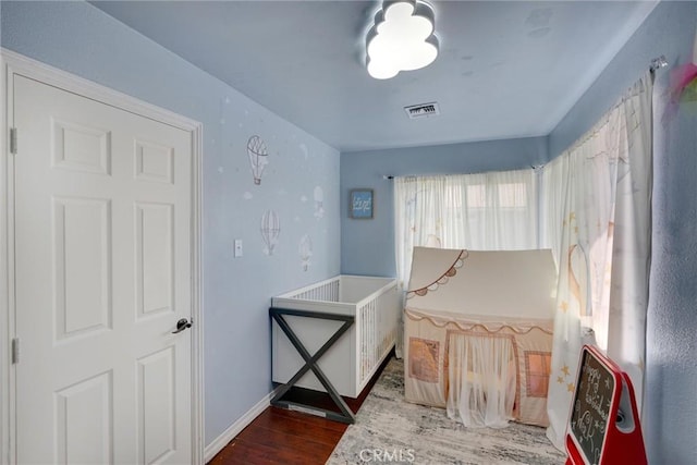 bedroom featuring dark hardwood / wood-style floors