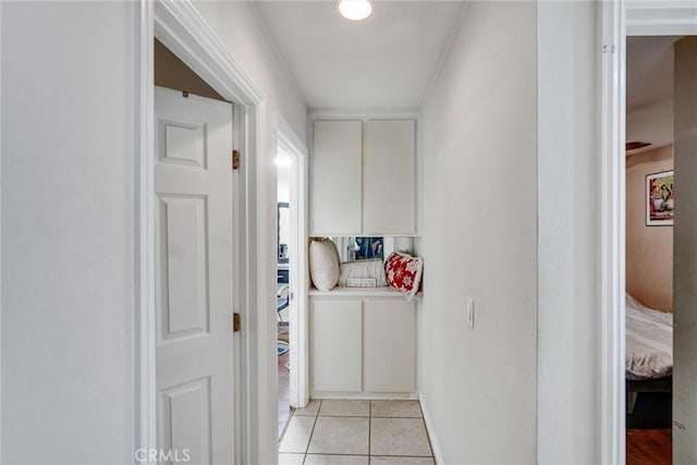 hallway featuring light tile patterned flooring