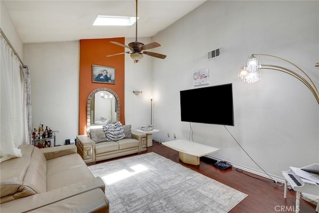 living room featuring ceiling fan, dark hardwood / wood-style flooring, and high vaulted ceiling