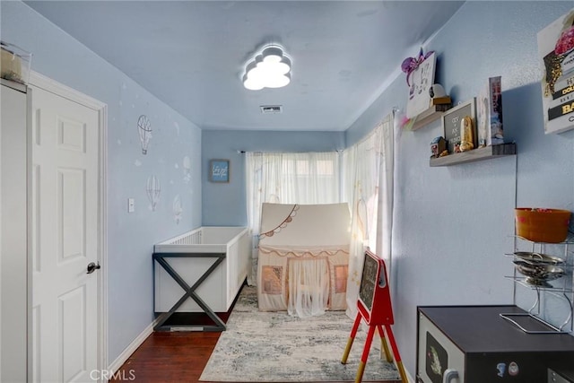 bedroom featuring dark wood-type flooring