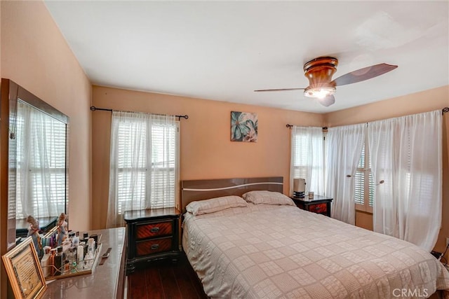 bedroom featuring hardwood / wood-style floors and ceiling fan