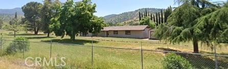 view of yard featuring a mountain view and a rural view