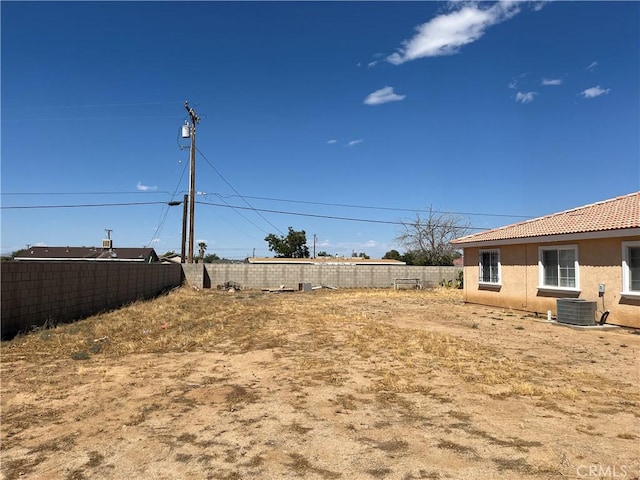 view of yard featuring cooling unit and a fenced backyard