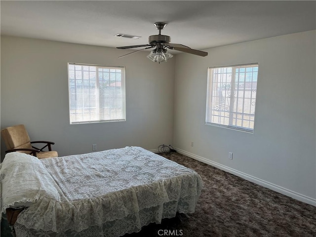 bedroom with ceiling fan and carpet flooring