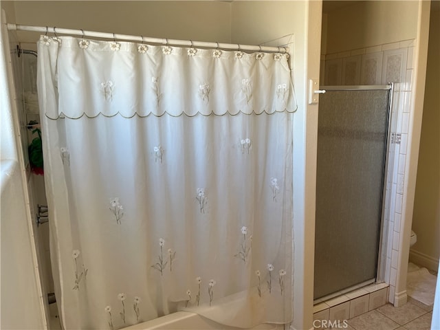 bathroom with tile patterned floors and a shower with shower curtain