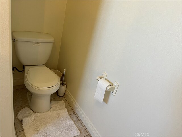 bathroom featuring tile patterned flooring and toilet