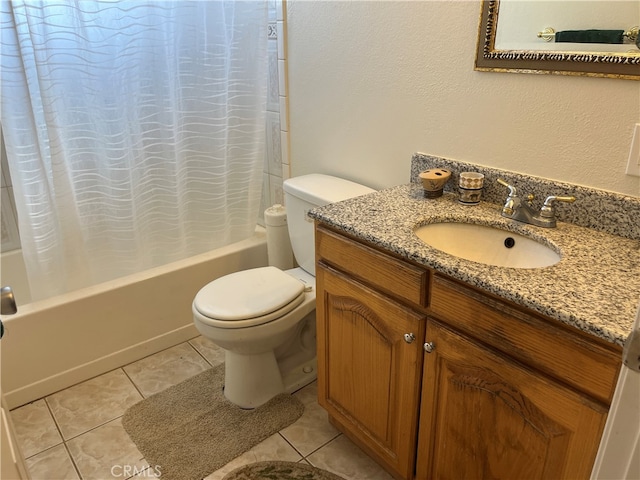 full bathroom with tile patterned flooring, vanity, shower / bath combo, and toilet