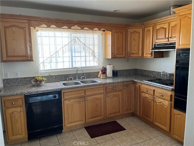 kitchen featuring light tile patterned floors, a sink, a warming drawer, black appliances, and brown cabinetry