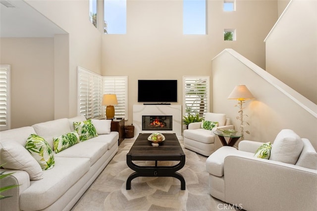 5564 Spinnaker Bay Dr, Long Beach, CA 90803 - living area with a towering ceiling, plenty of natural light, and a premium fireplace