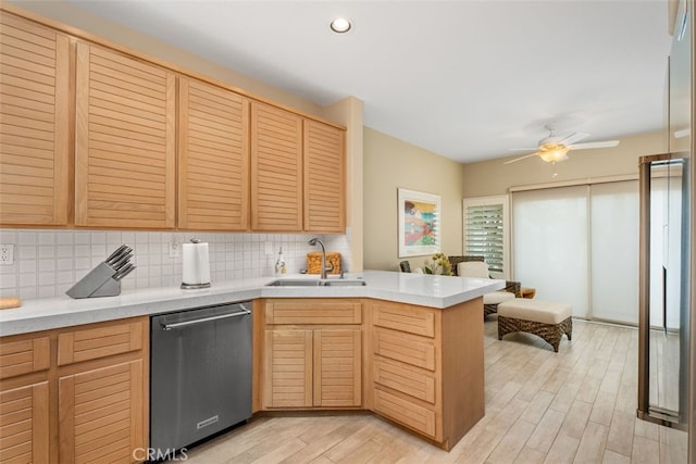 5564 Spinnaker Bay Dr, Long Beach, CA 90803 - kitchen featuring stainless steel dishwasher, a sink, a peninsula, tasteful backsplash, and light countertops
