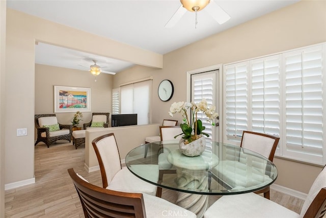 dining room featuring ceiling fan and light wood-type flooring