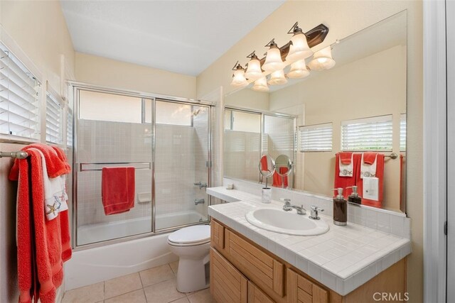 5564 Spinnaker Bay Dr, Long Beach, CA 90803 - full bathroom with vanity, toilet, combined bath / shower with glass door, and tile patterned floors