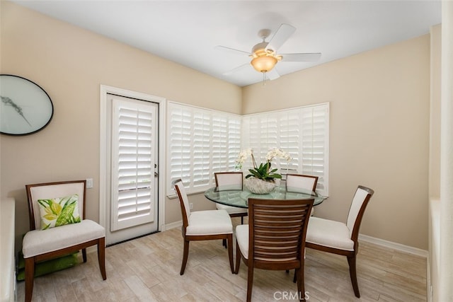 dining room featuring ceiling fan and light hardwood / wood-style floors