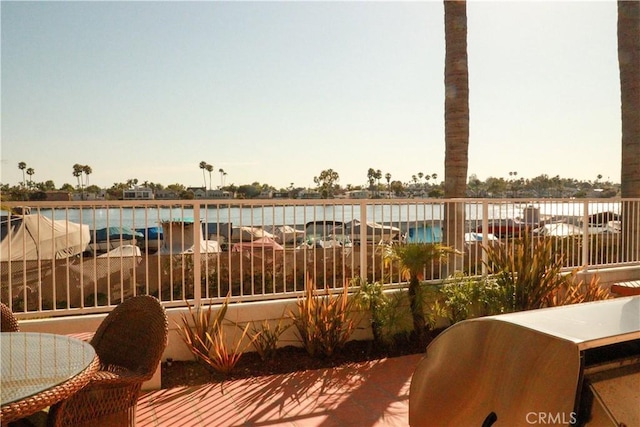 view of patio featuring a water view