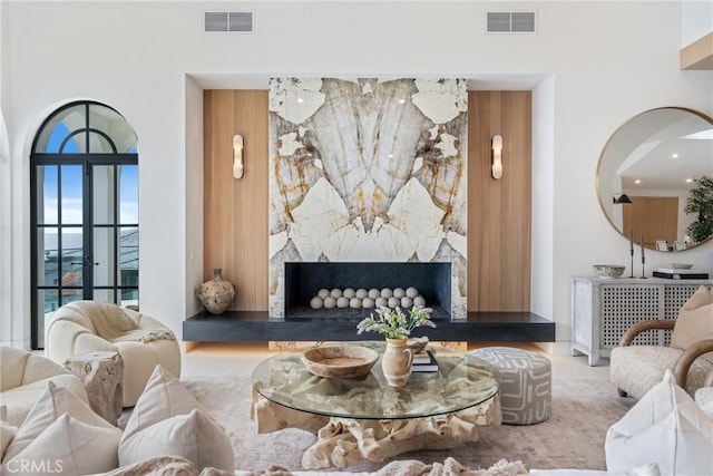 living room featuring a towering ceiling