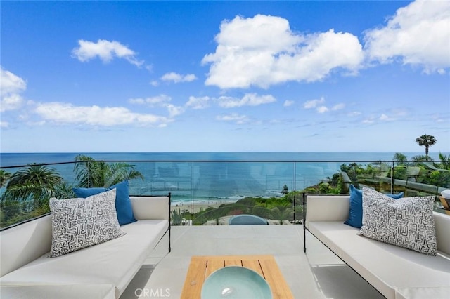 balcony with an outdoor hangout area and a water view