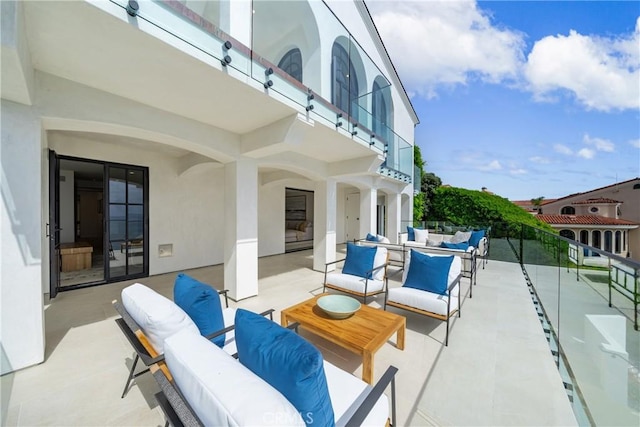 view of patio / terrace with outdoor lounge area and a balcony