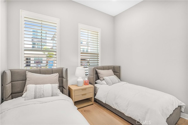 bedroom with hardwood / wood-style flooring