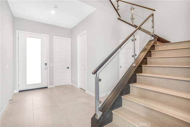 entrance foyer with light tile patterned floors