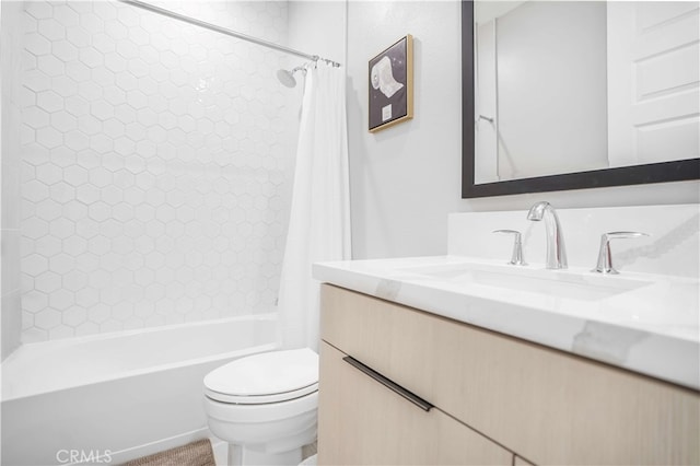 full bathroom with vanity, shower / tub combo, and toilet