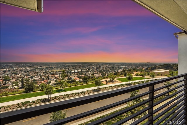 view of balcony at dusk