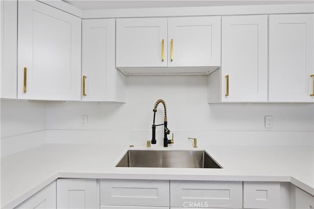 310 Whittley Ave Unit A, Avalon, CA 90704 - kitchen with white cabinets, light countertops, and a sink