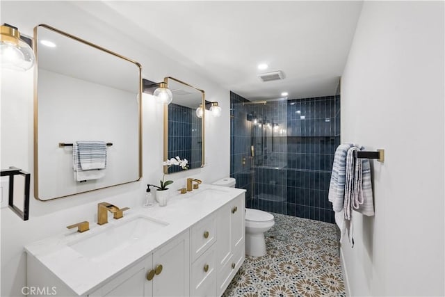 310 Whittley Ave Unit A, Avalon, CA 90704 - bathroom with toilet, a sink, a tile shower, and visible vents