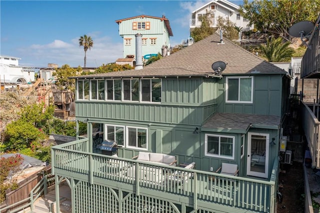 310 Whittley Ave Unit A, Avalon, CA 90704 - rear view of property featuring a shingled roof, a wooden deck, and board and batten siding