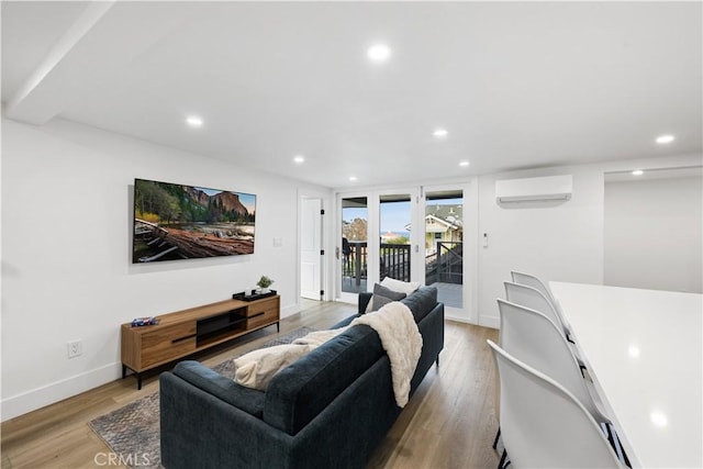 310 Whittley Ave Unit A, Avalon, CA 90704 - living area with a wall mounted air conditioner, baseboards, recessed lighting, and light wood finished floors