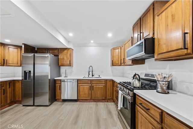 310 Whittley Ave Unit A, Avalon, CA 90704 - kitchen featuring a sink, brown cabinets, and appliances with stainless steel finishes