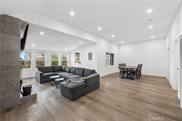 310 Whittley Ave Unit A, Avalon, CA 90704 - living area featuring electric panel, baseboards, wood finished floors, recessed lighting, and vaulted ceiling