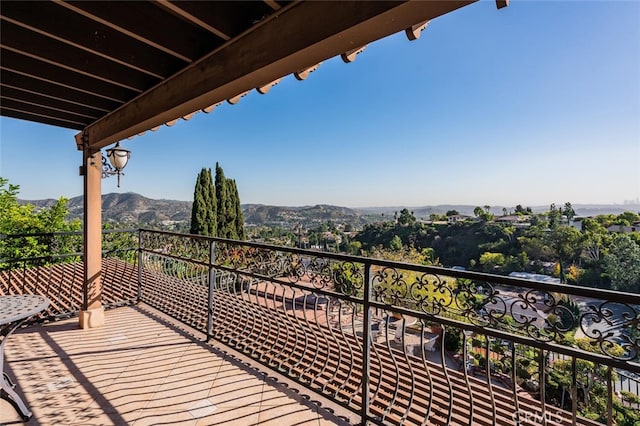 balcony featuring a mountain view