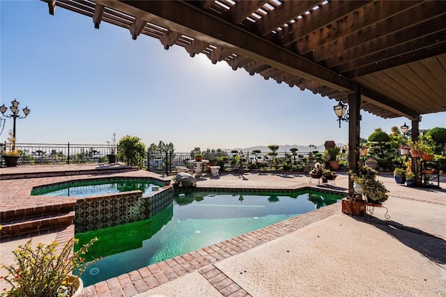 view of pool with an in ground hot tub and a patio area