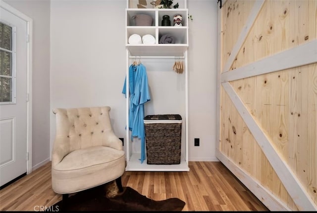 mudroom with light hardwood / wood-style flooring