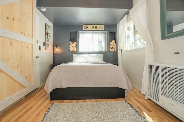 bedroom featuring hardwood / wood-style flooring