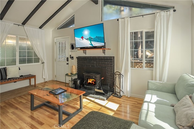 living room with high vaulted ceiling, beamed ceiling, wood-type flooring, and a fireplace