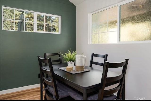 dining area with hardwood / wood-style flooring