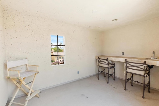 office featuring concrete flooring and sink