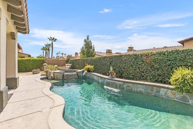 view of pool with an in ground hot tub