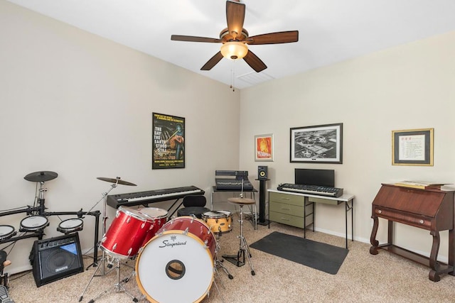 interior space featuring light carpet and ceiling fan