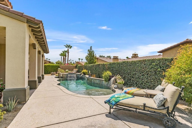 view of swimming pool with a patio